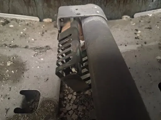 Gas oven bake burner and igniter under the oven floor panel
