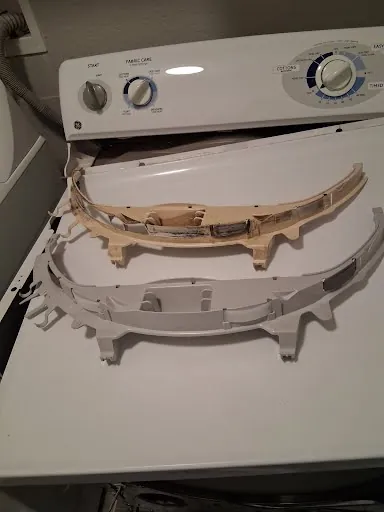 Top-load washing machine with the top and tub ring removed for service